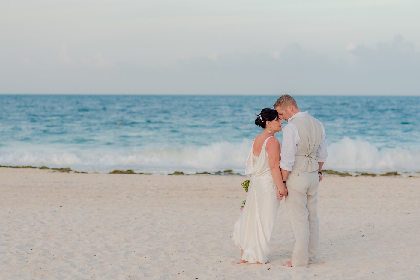 Bride and groom portraits on the beach in Costa Mujeres