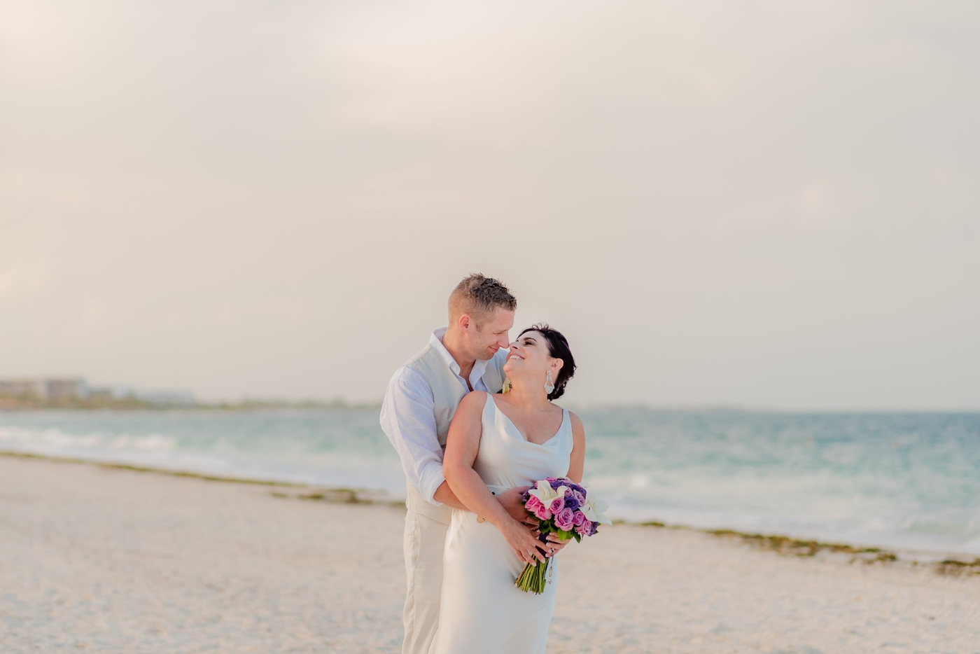 Bride and groom portraits on the beach in Mexico