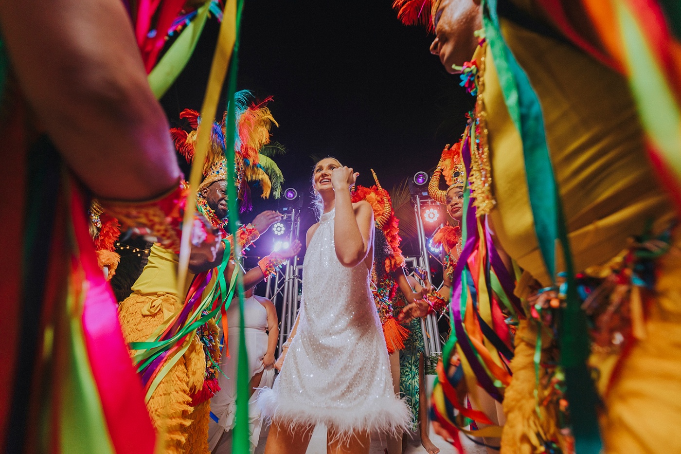 Bride dancing to la hora loca at a Caribbean beach destination wedding