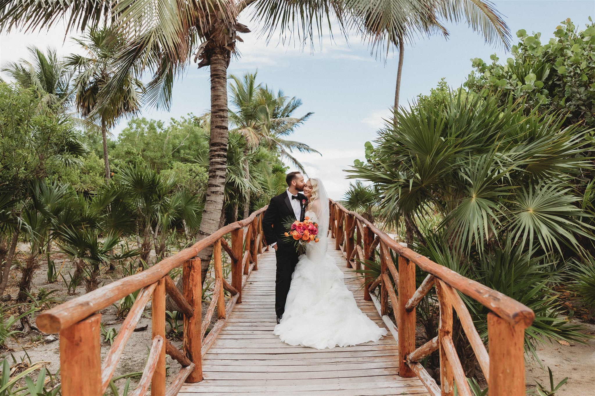 Wedding couple on wooden pathway at Unico 20 87