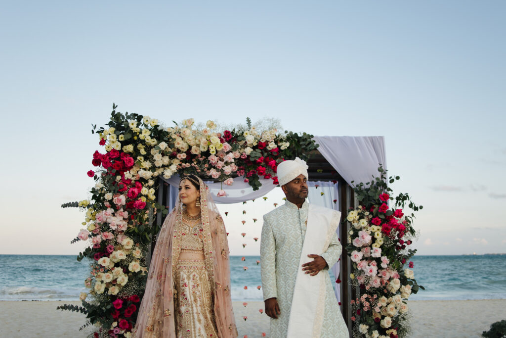 Secrets Playa Blanca South asian wedding couple at alter on beach