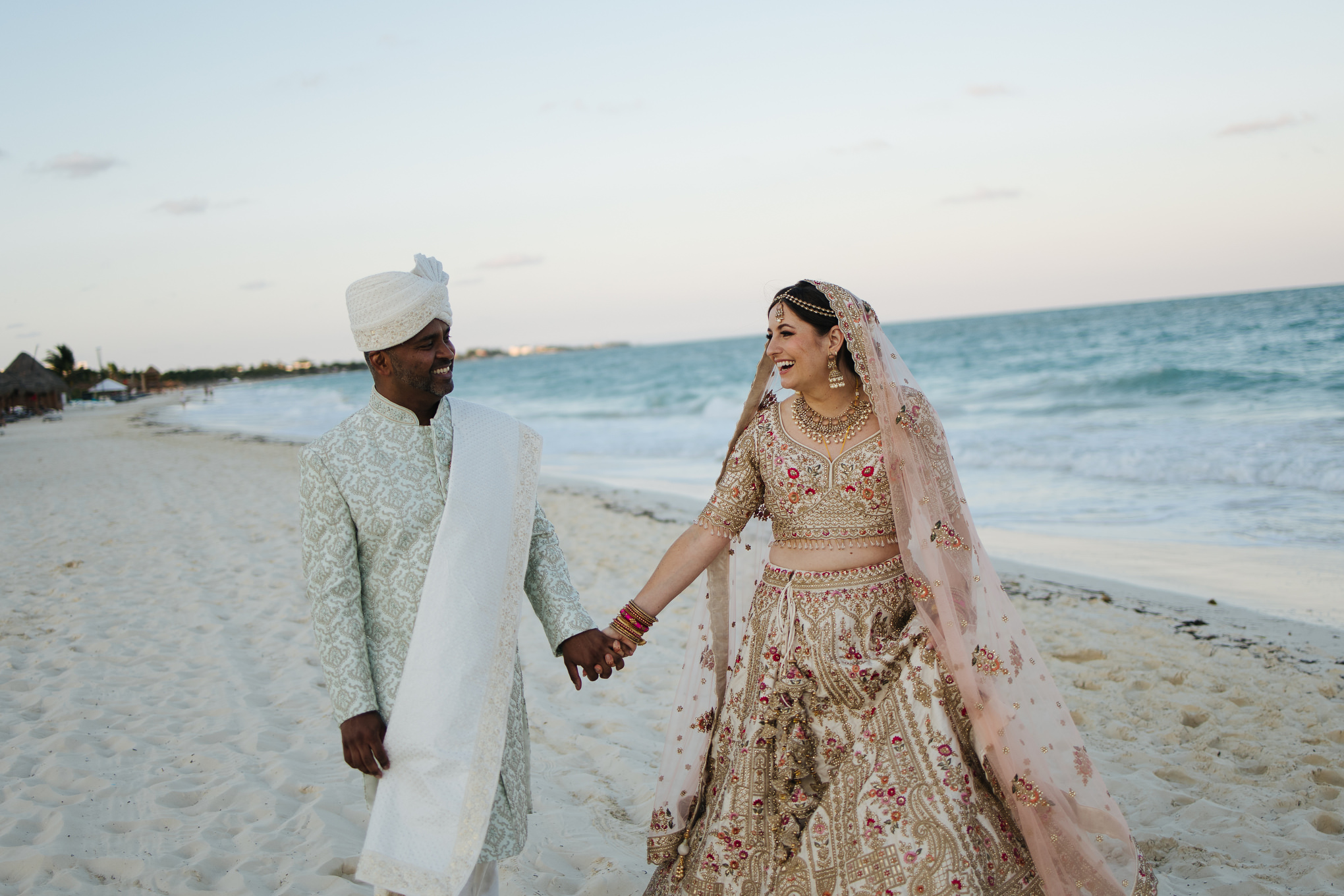 Secrets Playa Blanca South asian wedding couple walking beach