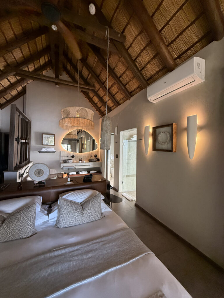 Luxury safari lodge bedroom with warm lighting, showing why South Africa is a good place for a honeymoon