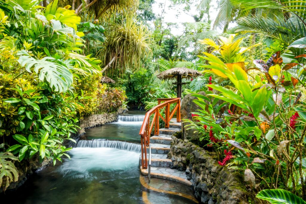 Layered hot springs surrounded by lush greenery in Costa Rica.